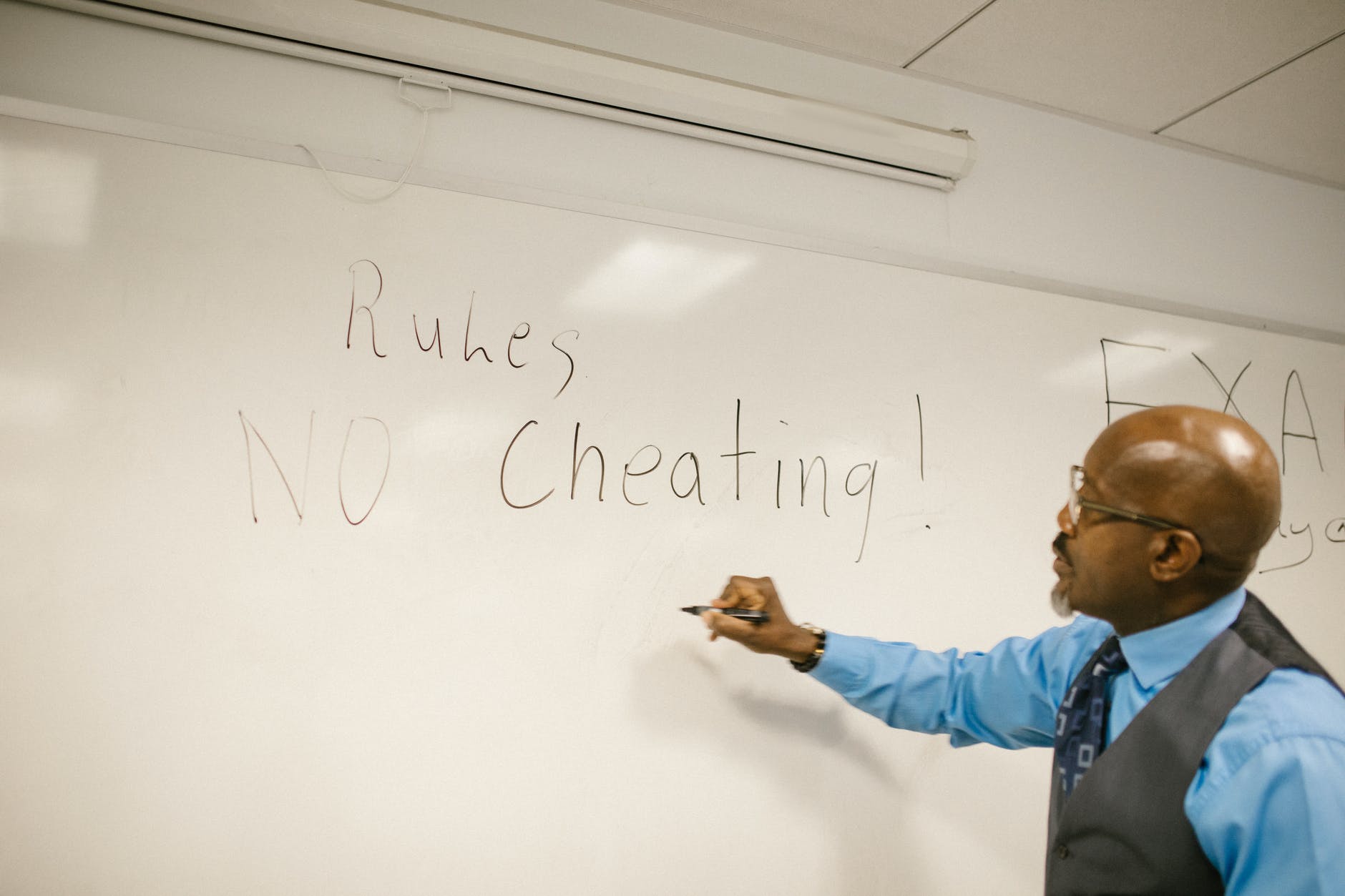 teacher giving instructions not to cheat