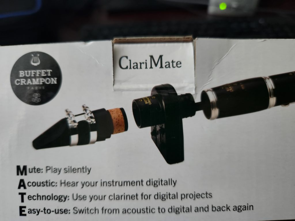 The box reads: 
Mute: Play silently
Acoustic: Hear your instrument digitally
Technology: Use your clarinet for digital projects
Easy-to-use: Switch from acoustic to digital and back again